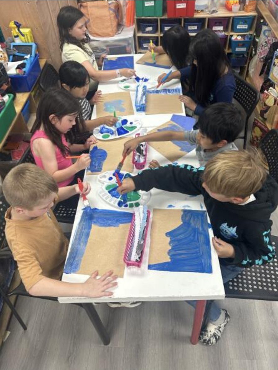 School-age children painting together