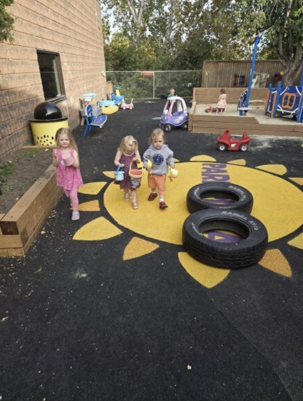 Toddlers exploring the sunshine playground
